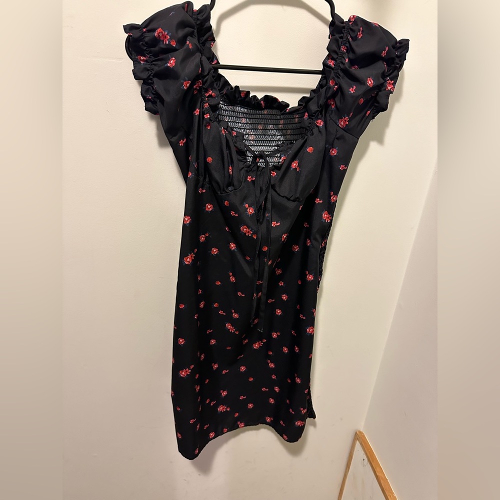 Navy blue with red flower cap-sleeve mini dress with smocking in back.